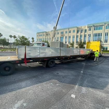 Commercial HVAC equipment delivery at a completed project